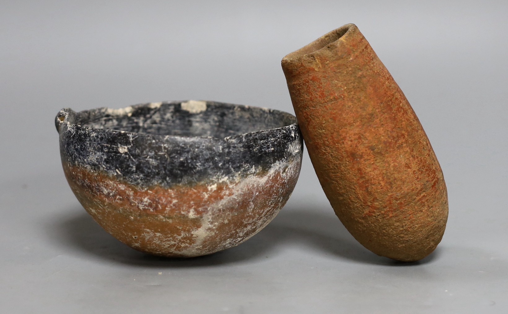 An ancient Egyptian vessel c.1400 BC, together with an ancient black-top bowl, possibly from the early Bronze Age, 14cm diameter, (2)